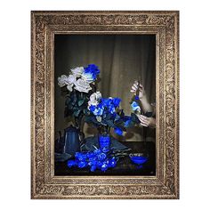 a painting with blue and white flowers in a gold frame