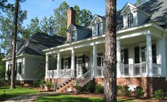 a large white house with porches and columns