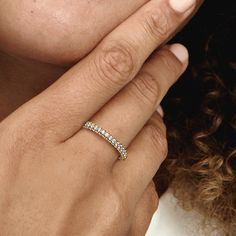 Stackable, radiant, timeless. Shining in 14k gold plating, our hand-finished Pandora Timeless Pavé Single-row Ring features one row of clear cubic zirconia around the center and one row facing outwards around each side, creating a slightly rounded square profile that sparkles from every angle. Style it on its own or with other Timeless Pavé pieces to create as much of a minimalist or maximalist effect as you want. - Pandora Timeless Pavé Single-row Ring - 14k Gold-plated unique metal blend / Cubic Zirconia / Clear - Sz. 8.5 Classic Gold Sparkling Rings, Diamond Rings In Yellow Gold With Sparkling Details, Yellow Gold Diamond Rings With Sparkling Details, Sparkling Diamond Rings In Yellow Gold, Sparkling Yellow Gold Cubic Zirconia Diamond Ring, Classic Sparkling 14k Gold Jewelry, Sparkling 14k White Gold Jewelry, Fine Yellow Gold Sparkling Rings, Refined Yellow Gold Jewelry With Vs Clarity