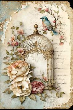 a birdcage with roses and birds on it next to a piece of paper