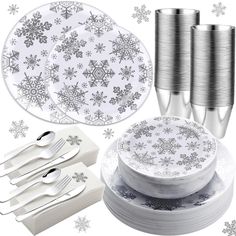 silver and white snowflake paper plates, forks, napkins and cups