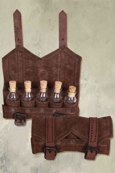 a leather case with six miniature bottles in it