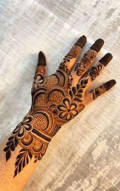 the hand is decorated with intricate designs