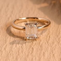 an engagement ring with a square cut diamond