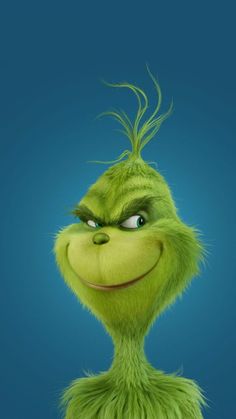 the grin movie poster with an angry grin face and green hair, in front of a blue background