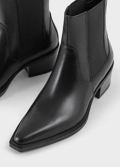 Kelsey is the minimalistic Chelsea boots with a western-inspired design. The style is crafted from black leather and features a pointed-toe shape, elastic side panels and pull-on tabs. The sleek block heels measure 40mm. Black leather Pointed-toe shape Elastic side panels 40mm heels Pull-on tabs For long-lasting care: use a black shoe cream and protector spray to ensure a longer lifespan. Shaft height: 168 mm Shaft width: 126 mm Heel height: 40 mm (based on size 37) Article no.: 5810-201-20 Pointed Toe Chelsea Boots With Stacked Heel, Black Chelsea Boots With Sculpted Heel For Work, Modern Pointed Toe Chelsea Boots For Business, Classic Chelsea Boots With Stacked Heel And Pointed Toe, Pointed Toe Chelsea Boots For Business, Business Chelsea Boots With Pointed Toe, Western Style Pointed Toe Chelsea Boots For Formal Occasions, Black Chelsea Boots With Sculpted Heel And Pointed Toe, Sleek Pointed Toe Chelsea Boots For Business