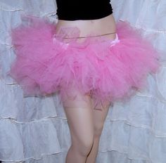 Cotton Candy Pink Tutu  pastel goth rave festival Trashy Ballet TuTu  tulle Skirt Adult All Sizes MTCoffinz This pouffy Tulle TuTu is huge. It's made with mountains of soft pastel candy pink bridal tulle. All of the pieces are hand torn and shredded to give this skirt maximum fullness.   It's machine washable and dryer safe. Plus, it has a soft stretchy elastic waist that fits several sizes perfectly. All of the fabric is stitched and serged onto the waistband for extreme durability. Measurements Small: Waist 24" to 32" Medium: Waist 33" to 42" Large: Waist 42" to 50" Length: 10" to 12" (ragged hem ) This skirt is made to order, please allow some time to create it. If you are on a really tight timeline, please ask before ordering. Instagram: @MTcoffinzclothing Goth Rave, Pastel Candy, Tulle Tutu Skirt, Pink Tutu, Ballet Tutu, Tulle Tutu, Pink Bridal, Pink Cotton Candy, Pink Girly Things