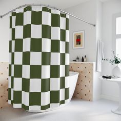 a green and white checkered shower curtain in a bathroom