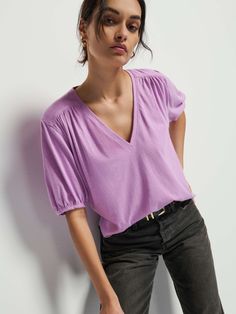 Not your boyfriend's v-neck. Shirred cuffs and front and back yoke give it that relaxed vibe, with a subtle balloon sleeve for a feminine twist. (This one comes in Violet Tulle). | Edie Top in Violet Tulle | Ethical Essentials Relaxed Fit V-neck Top For Spring, Chic Relaxed Fit V-neck Top, Effortless V-neck Blouse For Spring, Relaxed Fit V-neck Blouse For Daywear, Effortless V-neck Top For Daywear, Trendy V-neck Relaxed Fit Blouse, Relaxed Fit V-neck Top For Everyday, Jumpsuit Jacket, Strap Shoes