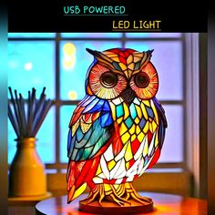 an owl lamp sitting on top of a table