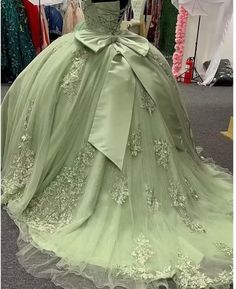 This beautiful Ball Gown Sage Green Quinceanera Dress features elegant off-the-shoulder lace applique for a stunning look. The soft, lightweight material and comfortable fit make this dress ideal for special occasions. Catalogue: Sage Green Sweet 16 DressVenues: Hall,Church,Beach / Destination,Garden / OutdoorBack Details: Lace upSeason: Spring,Summer,Winter,FallNeckline: Off the ShoulderMaterial: Lace Silhouette: Ball GownStyle: Vintage,ChicBody Shape: MissesSleeve Length: SleevelessWaist Line: Green Quinceneara Dress, Mint Quinceanera Decorations, Save Green Quince Dress, Sage Green Quinceanera Dresses With Cape, Light Green 15 Dresses Quinceanera, Tiana Quinceanera Dress, Olive Green Quinceanera Dresses, Light Green Quinceanera Dresses, Sage Green Quinceanera Dresses