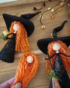 three witches with orange hair and black hats