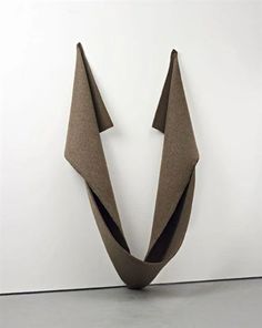 a sculpture made out of folded paper on the wall