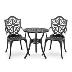 an outdoor table and two chairs with black wrought iron designs on the back, against a white background