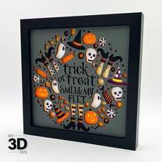 a shadow box frame with halloween decorations