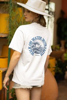 Introducing the 'WALK ON WATER WITH FAITH' Tee. Designed on the Central Coast of Australia with dreams of spreading The Word in style.  This surfy-style, heavyweight, 100% cotton t-shirt is a durable staple product with a classic and relaxed fit. (Looks great as a baggy shirt when ordered in a larger size to get that more laid-back, beachy look). Our shirts prices may be a bit higher than competitors, but this is due to our unique, hand-designed style along with the shirts we source which are top-quality. No boring, generic designs or cheap quality here! - Seamless double-needle collar - Double-needle sleeve and bottom hems - 100% cotton - Taped neck and shoulders for durability Womens Christian Shirts, Style Surf, Surf Apparel, Baggy Shirt, Faith Tees, Faith Christian, Walk On Water, Surf Outfit, Christian T Shirt