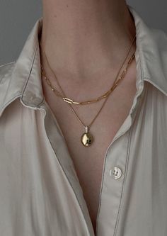 Home is where the heart is. Our Maison Gold Lockets are heirlooms that represent a moment in time. Keep this locket as a family heirloom forever. Wear her blank or get her engraved with your signature letter. To engrave more than one letter, visit HERE.Already have a chain? To purchase the locket individually, visit HERE. Photo dimensions: 14mm x 11.5mmTo add a photo inside, simply open the locket and carefully press the photo into place. Our lockets do not have a separate opening for a photo. F Gold Lockets, Oval Locket Necklace, Necklace Photo, 10k Gold Chain, Engraved Locket, Fall Rings, Oval Locket, Photo Dimensions, Bar Stud Earrings