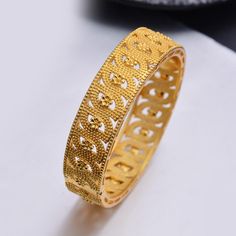 Afraic Jewelry- 24k 1Pcs Gold Color Bangles For women African bridal Bangles Bracelets Gold wedding gifts Ethiopian Bangles jewellery Model Number:3256801599135949 Our product is a relatively high-end product, the gold plating can be used with confidence. It is a practical product for your party wedding birthday party. Gold jewelry makes your life more fun and beautiful. We have been working hard to dear. Provide more and better products Marriage Bangle With Intricate Design, Gold Bangle With Elegant Design For Wedding, Gold Bangle Bridal Sets As Gift, Gold Bridal Bangle Set For Gift, African Gold Jewelry, Jewellery Model, African Gold, Ethiopian Jewelry, Moroccan Jewelry