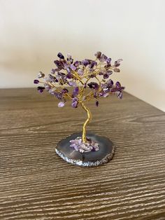 Crystal Gemstone Tree Decor with Natural Stones- Beautifully crafted crystal tree with natural stones and agate rock- It comes with little cute notes about crystal stone meaning.- It is in a beautiful gift box ready to give your loved ones!- Perfect decor for boho chic homes- Agate rock at the bottom of the treeAvailable in 7 colors:- Amethyst Crystal Tree (Purple)- Rose Quartz Crystal Tree (Pink)- Jade Crystal Tree (Green)- Citrine Crystal Tree (Yellow)- Carnelian Crystal Tree (Orange)- Sodalit Unique Natural Stones Crystals For Gifts, Unique Natural Stones Crystals As Gifts, Handmade Elegant Crystals For Gifts, Elegant Handmade Crystals For Gift, Bohemian Gemstone Crystals For Gifts, Bohemian Natural Stone Crystals For Gifts, Bohemian Natural Stone Crystals As Gift, Unique Handmade Crystals For Gifts, Handmade Unique Crystals For Gifts