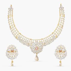 Description: Add a touch of timeless elegance to your look with this exquisite Nakshatra CZ necklace set. Crafted from high-quality CZ stones, and freshwater pearl drops, this jewelry is bold and beautiful. It features intricate ivy and floral motifs that capture the divine beauty of Indian culture. Perfect for special occasions or adding an extra sparkle to your everyday look, this necklace set is sure to make a lasting impression. Details & Specifications: Materials used: CZ stones with White Festive White Cubic Zirconia Necklaces, Festive White Cubic Zirconia Necklace, Elegant Diwali Necklaces With Stone Setting, White American Diamond Necklace For Diwali, Elegant Necklaces With Stone Setting For Diwali, Elegant Temple Necklace With Stone Work, Elegant Stone Setting Necklaces For Diwali, Diwali White Diamond Necklace, White Diamond Necklace For Diwali