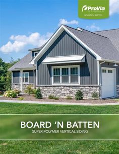 a gray house with the words board'n batten on it and an image of a