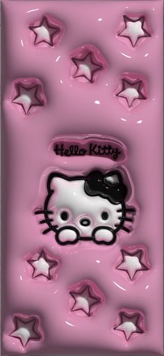 a pink hello kitty cookie sheet with white stars and black cat on it's face