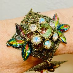 This Stunning Bracelet Is A One-Of-A-Kind Vintage Piece From The 1950s-60s. The Cuff Style Bracelet Is Made With A Mix Of Glass, Rhinestone, And Crystal Materials, And Features A Beautiful Multicolor Design That Is Perfect For Any Occasion. The Bracelet Is Adjustable For A Comfortable Fit, And Has A Toggle Closure. It Measures Approx 7 Inches In Length And Is A Great Addition To Any Jewelry Collection. This Vintage Bracelet Is Handmade And Has A Unique Assemblage Of Vintage Clip Earrings From Va Vintage Jeweled Bracelets For Party, Multicolor Retro Jewelry For Vintage Collection, Multicolor Vintage Jewelry With Vintage Charm, Retro Multicolor Jewelry For Wedding, Multicolor Retro Jewelry For Wedding, Vintage Multicolor Metal Jewelry, Vintage Multicolor Wedding Jewelry, Vintage Jubilee Bracelet For Party, Retro Multicolor Wedding Jewelry