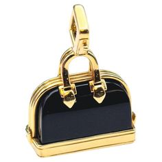 Elevate your style with this contemporary Louis Vuitton Onyx and 18k Yellow Gold Alma Bag Charm Pendant. This exquisite piece seamlessly combines modern luxury with the timeless elegance of Louis Vuitton, showcasing the brand's dedication to craftsmanship, sophistication, and iconic design. Crafted in lustrous 18k yellow gold, this charm pendant exudes a contemporary allure. Its surface is adorned with a sleek, polished onyx, adding a touch of refined contrast and depth. The onyx is expertly set Louis Vuitton Vintage Bag, Fancy Purses, Gothic Bracelet, Silver Handbag, Louis Vuitton Vintage, Louis Vuitton Fashion, Vintage Bag, Modern Necklaces, Vintage Louis Vuitton