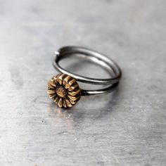 Adjustable floral sunflower ring to wear as knuckle ring, toe ring or as a regular ring on any finger. The tiny flower is made in bronze and the adjustable ring band in stainless steel. Both bronze and steel are strong hard metals and this makes a very durable design. MADE ON DEMAND, takes me up to 7 workdays to complete.Here you find other designs with flowers https://www.etsy.com/se-en/shop/AnnaSiivonen?ref=seller-platform-mcnav&search_query=flower Adjustable Bronze Metal Ring, Dainty Adjustable Nickel-free Toe Rings, Adjustable Flower Ring For Promise Occasion, Dainty Adjustable Hand Forged Stackable Rings, Adjustable Flower Shaped Metal Ring, Dainty Hand Forged Adjustable Stackable Rings, Adjustable Metal Flower Ring, Adjustable Tiny Flower Ring, Adjustable Metal Flower Promise Ring