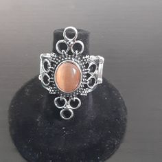 Silver With Tan Gem With Stretch Ban To Fit Anyone Adjustable Oval Rings In Brown, Adjustable Oval Brown Rings, Nickel-free Brown Jewelry, Adjustable Brown Ring Jewelry, Stretchy Rings, Brown Rings, Jewels Rings, Rhinestone Ring, Purple Rhinestone