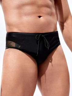 Elevate your beach attire with our Mesh Waist Swim Brief, a must-have addition to your swimwear collection. In classic black, this brief features a plain pattern and an eye-catching contrast mesh detail, adding a modern edge. The medium-stretch fabric ensures a comfortable fit, allowing you to enjoy your time in the water. Features: Color: Black Pattern Type: Plain Details: Contrast Mesh Type: Briefs Fabric: Medium Stretch Material: Fabric Care Instructions: Hand wash, do not dry clean Size Char Black Nylon Swimwear For Vacation, Stretch Nylon Swim Trunks For Beach, Stretch Nylon Swim Trunks For Beach Season, Summer Nylon Swim Trunks Brief, Black Beachwear Swim Trunks For Surfing, Sports Swimwear With Tie-side Bottom In Nylon, Nylon Swim Trunks Briefs, Sports Nylon Swimwear With Tie-side Bottom, Fitted Black Swim Trunks For Vacation