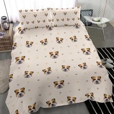 a bed with a white and brown dog on it