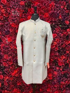 This classic Jodhpuri kurta is a wardrobe essential for every man. Its timeless design and versatile color make it perfect for any occasion. The high-quality fabric ensures comfort and durability. Key Features with Short Descriptions: Color - Snow Off-White with Gold Embroided. Jodhpuri Style: A classic and timeless design. Intricate Embroidery: Adds a touch of elegance and sophistication. Luxurious Fabric: Ensures comfort and durability. Comfortable Fit: Allows for ease of movement. Versatile C Designer Cotton Kurta For Formal Occasions, Designer White Nehru Jacket, Designer Straight Kurta For Diwali, Designer Cotton Bandhgala Straight Kurta, Designer Cotton Bandhgala In Straight Kurta Style, Designer Cotton Fitted Sherwani, Designer Fitted Cotton Sherwani, Designer Semi-formal Kurta For Transitional Seasons, Designer Dabka Kurta