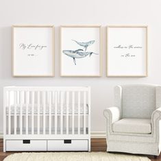 a baby's nursery room with two whale prints on the wall