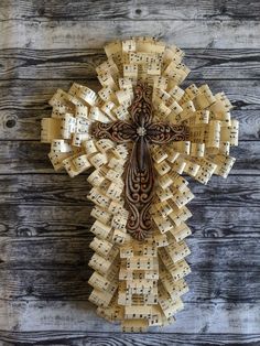 an intricate cross made out of sheet music