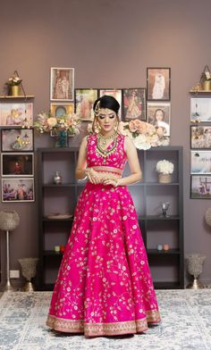 Pink signifies feminity and romance. This pink lehenga is very chic. For all the cool girls, this is the right choice. Sleeveless blouse and skirt with all-over embroidery of light floral jaal made with zari sequins. Cutdana and Resham. Beautiful pink and gold drops on the blouse hemline will steal your heart. Light yet classy pink lehenga with gold borders delivers a very sophisticated look. You have the option to change the color of the garment and make it according to your requirements. Pleas Curated Outfit, Add Sleeves, Hot Pink Color, Pink Lehenga, Embroidery Materials, Color Wedding, Wedding Lehenga, Blouse And Skirt, Sleeveless Blouse