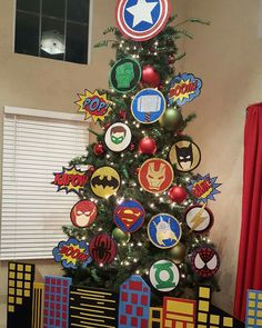 a christmas tree decorated with superheros and stars