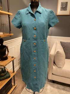 Field Manor, Blue, Dress, Shirtdress, Collared, Short Sleeve, Front Buttons, Size S, Minimalist, Summer, Fashion, Outfit, ~ 20-30-1049 Gorgeous blue dress! By Field Manor. See the photos for details. ' ' ' ' ' | ' ' ' ' ' | ' ' ' ' | ' ' ' ' | ' ' ' ' | ' ' be sure to measure ' ' | ' ' ' ' | ' ' ' ' | ' ' ' ' | ' ' ' ' ♥ Waist (laying flat): 17" ♥ Shoulder to Sleeve: 10" ♥ Overall Length from shoulder: 40" All measurements are taken while garment is laying flat. Please double the measurements wh Fitted Short Sleeve Midi Dress With Placket, Fitted Midi Dress With Placket And Short Sleeves, Fitted Solid Color Cotton Shirt Dress, Fitted Cotton Solid Color Shirt Dress, Fitted Cotton Solid Shirt Dress, Fitted Cotton Shirt Dress, Classic Blue Shirt Dress For Summer, Blue Short Sleeve Midi Dress With Button Closure, Blue Midi Dress With Short Sleeves And Button Closure