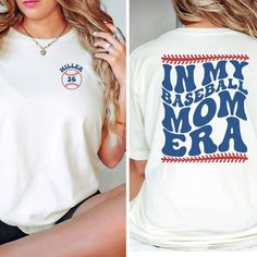 This custom IN MY BASEBALL MOM ERA Bella and Canvas shirt is perfect for all those game days ahead!  Are you a t-ball mom or a baseball mom?  This mom era t-shirt is a retro and trendy way to show your love for baseball season and your baseball mama season of life.  Make it extra special with the addition of your player's name and jersey number on the front.  Buy for yourself or make this a Mother's Day, birthday gift, Christmas gift, or team mom gift for your favorite baseball mama. PLEASE READ THROUGH ALL OF THE FOLLOWING INFORMATION.  IF YOU HAVE FURTHER QUESTIONS, WE ARE HAPPY TO HELP! Welcome to CuratedClothCo.!  Here you can find the perfect, trendy attire whether you are gifting for someone else or yourself.  We strive to provide quality merchandise and quick customer service in ord Letter Print Baseball Jersey For Game Day, Fan Merchandise Baseball Jersey With Letter Print, Letter Print T-shirt For Baseball Season Sports Events, In My Baseball Mom Era, Fan Merchandise Letter Print Baseball Jersey, Baseball Season Crew Neck Jersey With Name Print, Letter Print Baseball Jersey With Crew Neck, White T-shirt With Baseball Collar And Pre-shrunk, Crew Neck Letter Print Baseball Jersey For Sports Fans