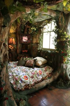 a bed in the middle of a room with plants growing on it's walls