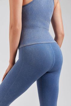 Lightweight Comfort: Feel like you're wearing a second skin with our ultra-light Seamless Wash Denim Leggings, crafted for ultimate comfort and breathability during any activity. Flattering Fit: Engineered with a scoop neckline and racerback design, these denim leggings provide light-to-medium support and flatter every figure with their unique fit. Versatile Style: Perfect for studio and streetwear, these high waist denim leggings offer a seamless transition from yoga class to casual outings, en Casual High Stretch Seamless Leggings, Seamless Casual Activewear With Tight Fit, Casual Breathable Snug Fit Bottoms, Casual Snug Fit Breathable Bottoms, Casual Stretch Leggings With Seamless Construction, Casual High Stretch Seamless Yoga Pants, Versatile Stretch Ribbed Bottoms, Seamless Bottoms For Pilates In Casual Style, Seamless Tight Casual Activewear