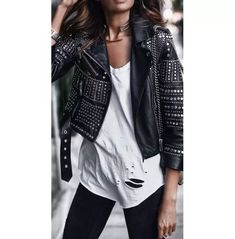 Introducing our stunning New Women Black Leather Jacket embellished with Silver studs. This stylish jacket is the perfect addition to any fashion-forward woman's wardrobe. Crafted from 100% genuine high-quality leather, this jacket is not only durable but also exudes an air of sophistication. The studded work on this jacket adds a touch of edginess and uniqueness, making it stand out from the crowd. The fine premium stitching ensures that every detail is perfectly executed, giving you a flawless and polished look. Designed with your comfort in mind, this jacket features an inside lining and pocket, providing you with added warmth and functionality. The zipper details on the sleeves add a trendy and modern twist to this classic jacket. We take pride in offering the highest quality products Women Black Leather Jacket, Spiked Leather Jacket, Punk Leather Jacket, Punk Jacket, Leather Jacket For Women, Gothic Jackets, Womens Wardrobe, Studded Leather Jacket, Studded Jacket