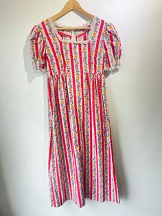 Pink Striped Floral Maxi Dress in excellent condition. 100% cotton. Literally the cutest print ever. Ties at the waist with removable belt and has lace details on collar and sleeves. Approximate measurements:Waist: 15"Length: 50" Fitted Cotton Prairie Dress For Daywear, Spring Cotton Prairie Dress, Midi Length, Spring Cotton Fitted Prairie Dress, Cotton Vintage Midi Dress For Garden Party, Casual Floral Print Cotton Vintage Dress, Cotton Prairie Dress For Summer Daywear, Cotton Prairie Dress For Garden Party, Midi Length, Cotton Midi Length Prairie Dress For Garden Party, Casual Vintage Cotton Dress With Floral Print