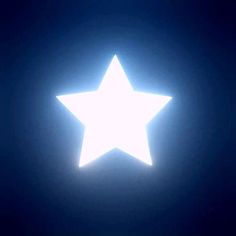 a large white star is shining in the dark