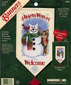 a cross stitch kit with a snowman and two cats