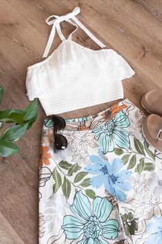 Our Poppy Floral Wide Leg Pants are ideal for adding a fun and colorful touch to your look this summer. Perfect for the beach or everyday wear, they'll keep you both comfortable and stylish! #outfitinspo #ootd #grwm #flatlay #beach #vacationstyle #sunglasses #boutique #shopping #outfit #floralpant Bohemian Bottoms For Beach Season Summer Outings, Bohemian Shorts For Beach Party In Spring, Bohemian Style Bottoms For Beach Season, Bohemian Style Shorts For Beach Party In Spring, Trendy Summer Bottoms With Elastic Waistband, Casual Beach Bottoms For Spring, Bohemian Bottoms For Summer Beach Party, Bohemian Bottoms For Beach Party In Summer, Trendy Summer Cotton Pants