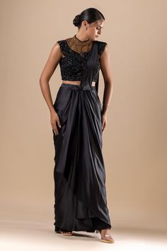 Black pre-draped saree. Paired with a padded blouse with crystal, cutdana, sequins and Swarovski embroidery. - Aza Fashions Elegant Saree-style Draped Skirt For Party, Elegant Party Draped Saree Skirt, Evening Choli With Sheer Dupatta And Draped Design, Silk Floor-length Pre-draped Saree For Party, Evening Draped Choli With Sheer Dupatta, Evening Silk Lehenga With Draped Style, Silk Draped Lehenga For Evening, Black Bollywood Style Pre-draped Saree, Black Silk Pre-draped Saree For Party