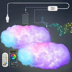 there are two cloud like objects with remote controls in front of them and an electronic device on the other side