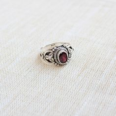 Gemstone - Garnet cut Stone Gemstone Size - 10x08 oval Metal - Sterling Silver Garnet is such an energizing stone, often used for manifestation purposes and worn as a talisman for good luck The ring can be customized on request and gemstone can be switched to any gemstone you want. The same Design is uploaded with Cirtine and Labradorite as well. Feel free to contact me for any queries regarding jewelry for bulk order please contact me through messages. The ring will be a gift wrapped in a premi Red Oval Cabochon Ring, Oval Ruby Rings Suitable For Gifts, Oval Ruby Rings For Gift, Oval Red Gemstone Birthstone Ring, Red Oval Crystal Ring With Accent Stones, Oval Ruby Crystal Ring As Gift, Oval Cabochon Ruby Ring Gift, Oval Cabochon Ruby Ring Birthstone Gift, Oval Birthstone Ring With Accent Stones For Gift