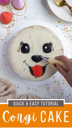 someone is decorating a cake with the face of a dog